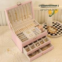 Large leather jewelry box by PETART with three-tier drawers for necklaces, earrings, and bracelets, gold accents and spacious storage.