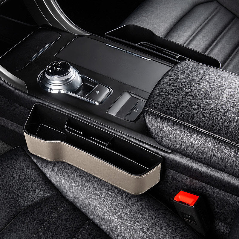 Aiqi car seat gap storage box fitting between car seats for organized, accessible storage in a vehicle.
