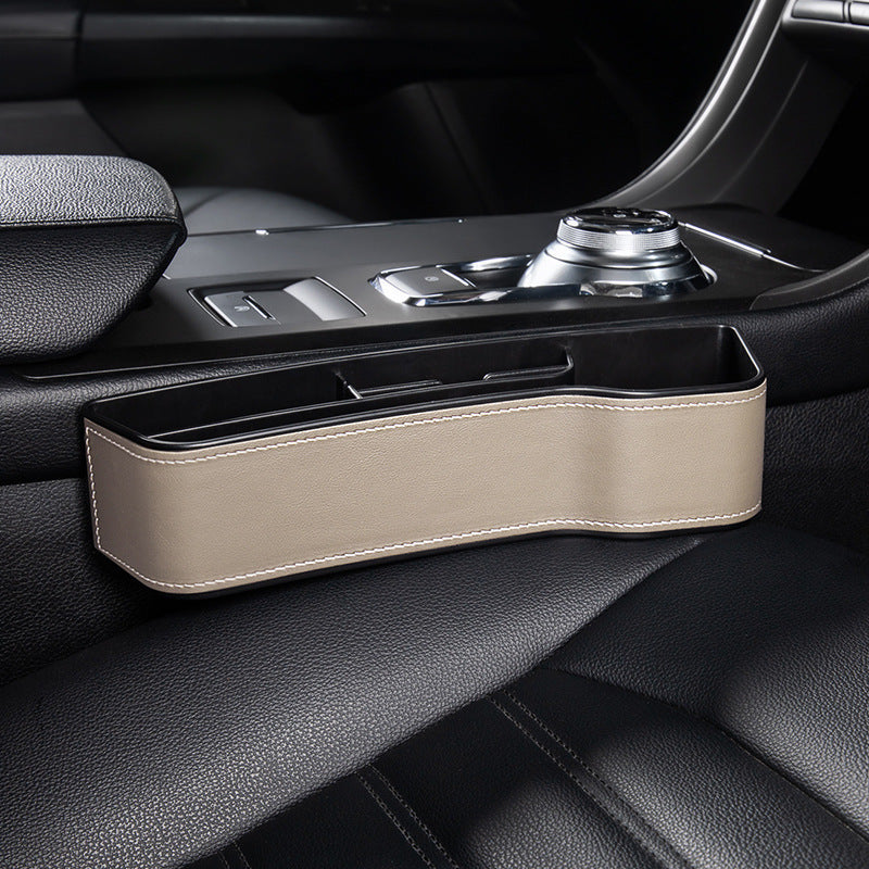 Aiqi car seat gap storage box fitting between car seats for organized storage of small items.