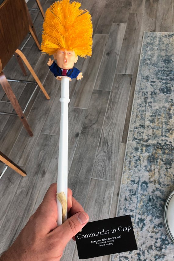 RenFan funny Donald Trump toilet brush in bathroom, featuring humorous design and durable cleaning brush for bathroom use.