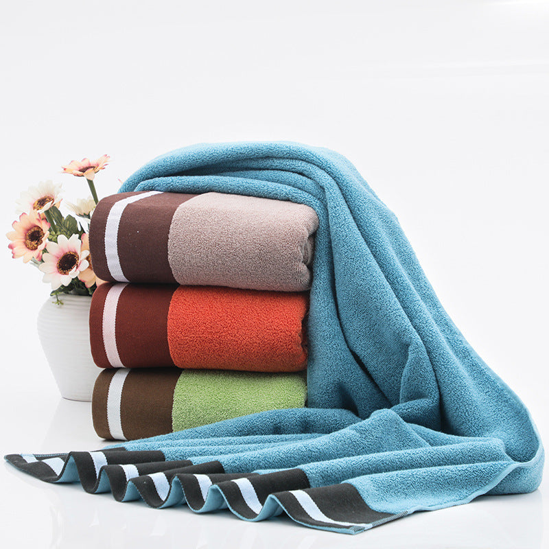 White cotton bath towel with textured weave and soft feel for everyday home bathroom use.