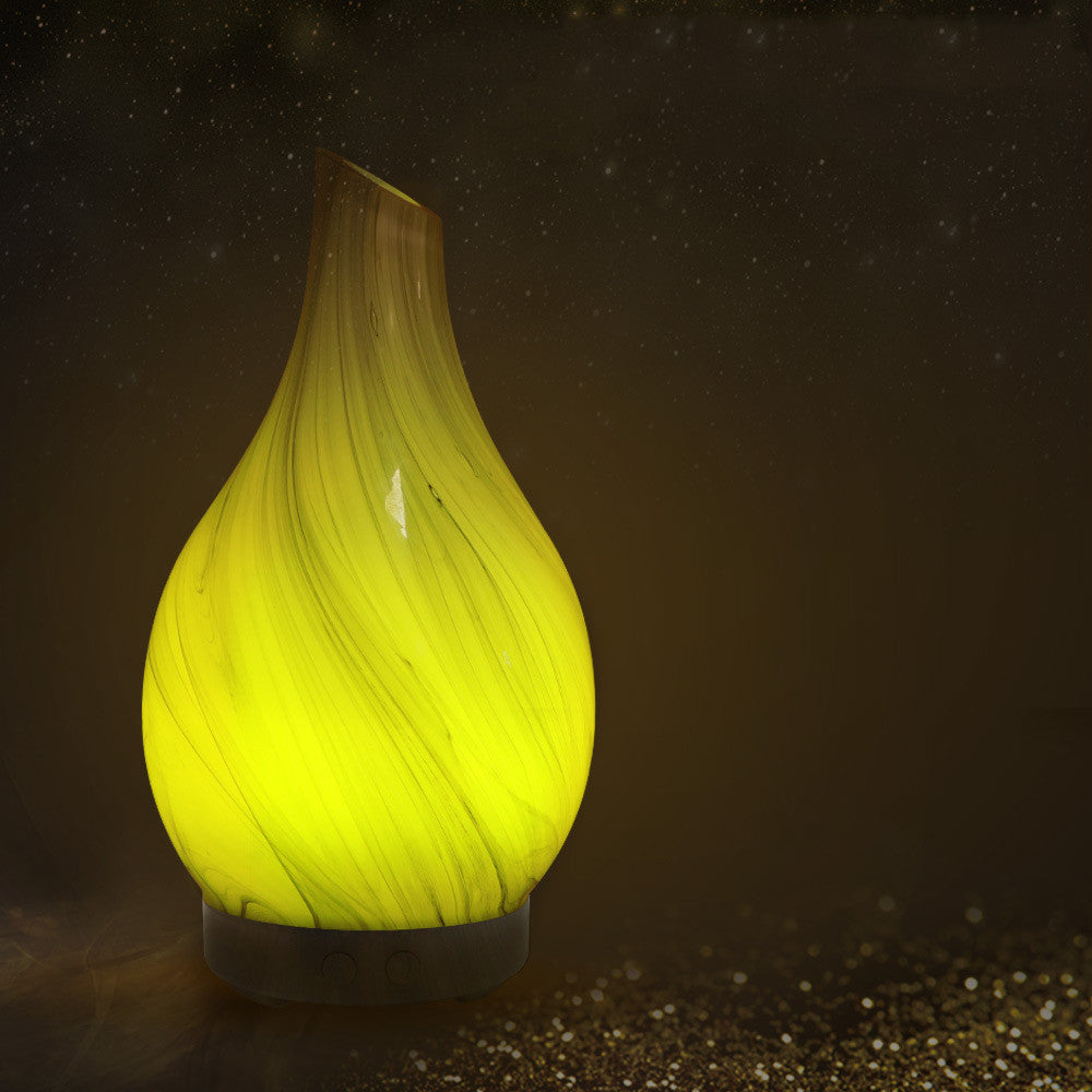 Colorful aromatherapy humidifier machine by RenFan, with vibrant design and mist diffuser for home relaxation.