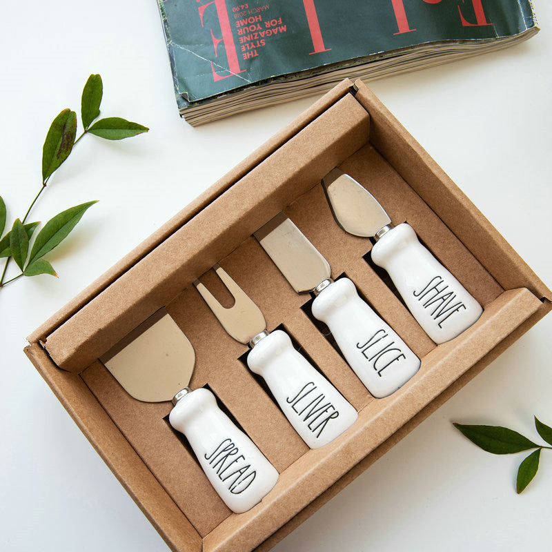 Set of four RenFan butter knives for cheese, bread, and dessert with stainless steel blades and comfortable handles.