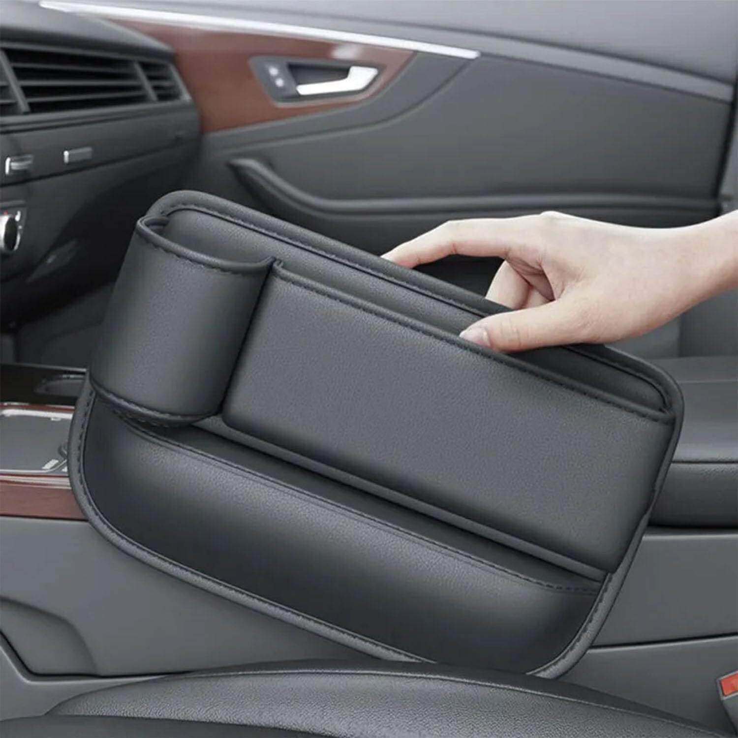 Car seat storage box with cup holder and adjustable design, ideal for organizing car interior and preventing items from falling.