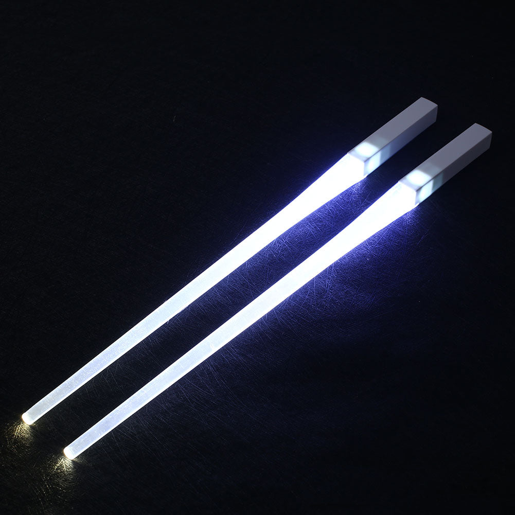 RenFan glowing kitchen chopsticks shown in use, illuminated in dark, highlighting their glowing feature and sleek design.