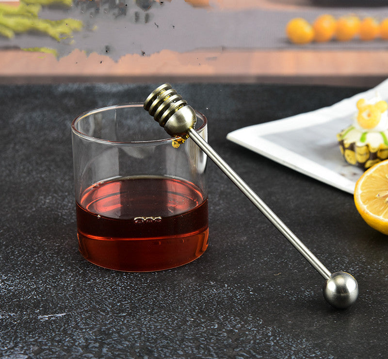 Stainless steel honey spoon with long handle, used for honey jars and dessert stirring, by RenFan kitchen tool brand.