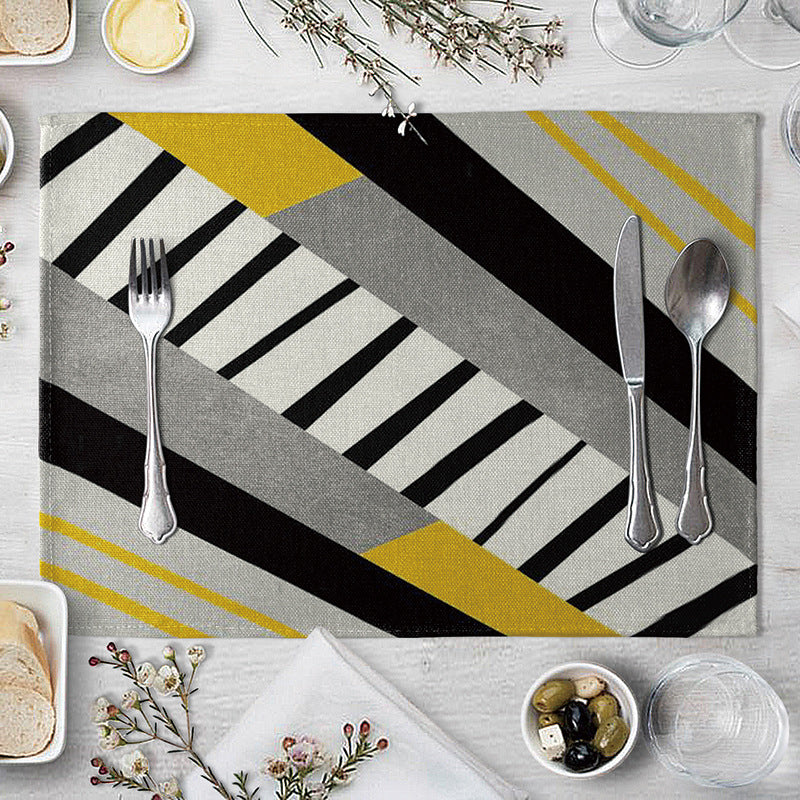 Aiqi geometric pattern dining table placemat made of kitchen supplies, featuring a modern design on a wooden table.