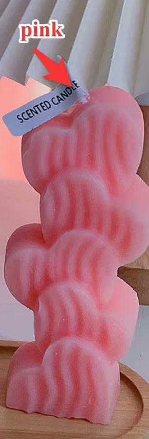 Aiqi Heart Column Aromatherapy Candle with a decorative heart-shaped design and soft glowing light.