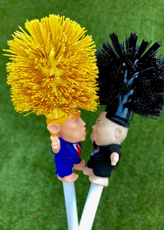 RenFan funny Donald Trump toilet brush in bathroom setting, featuring a humorous caricature design for cleaning use.