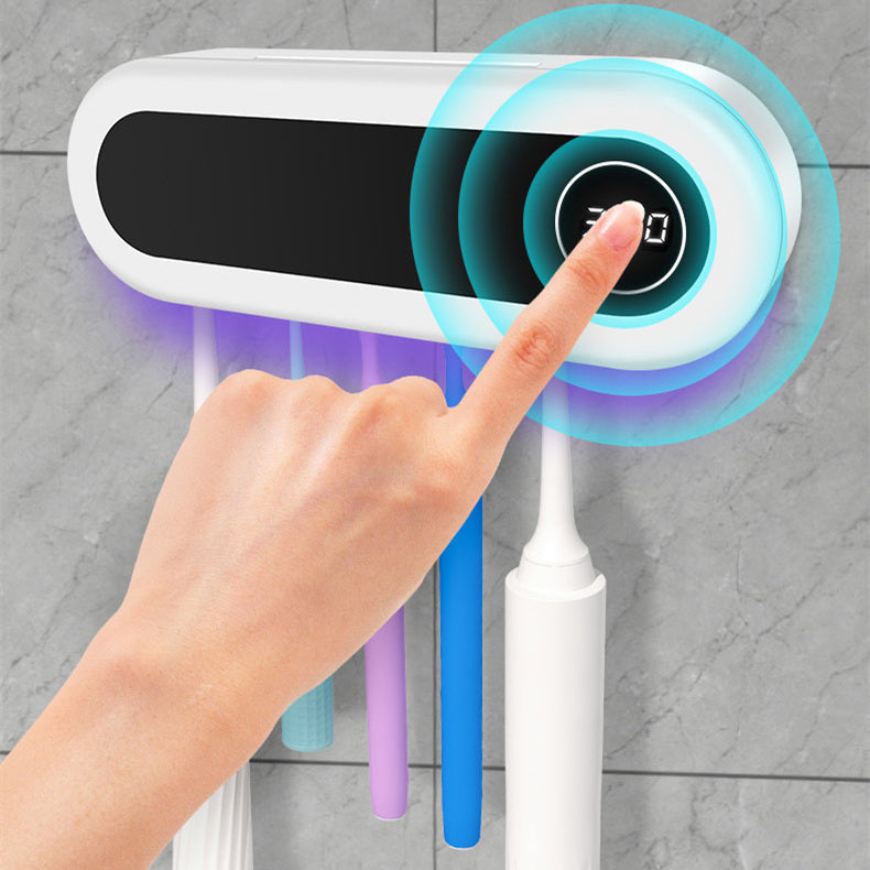 Jingqian wall-mounted toothbrush holder with UV sterilizer, toothpaste dispenser, and bathroom accessories in a modern bathroom setting.