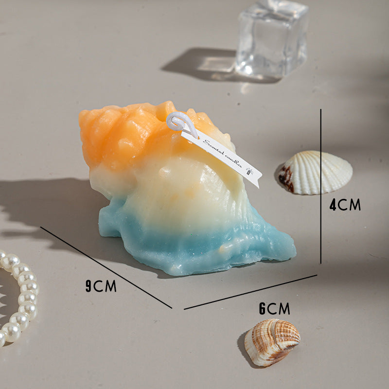 RenFan conch shell aromatherapy candle gift with a burning candle inside, showcasing a natural shell design for calming ambiance.