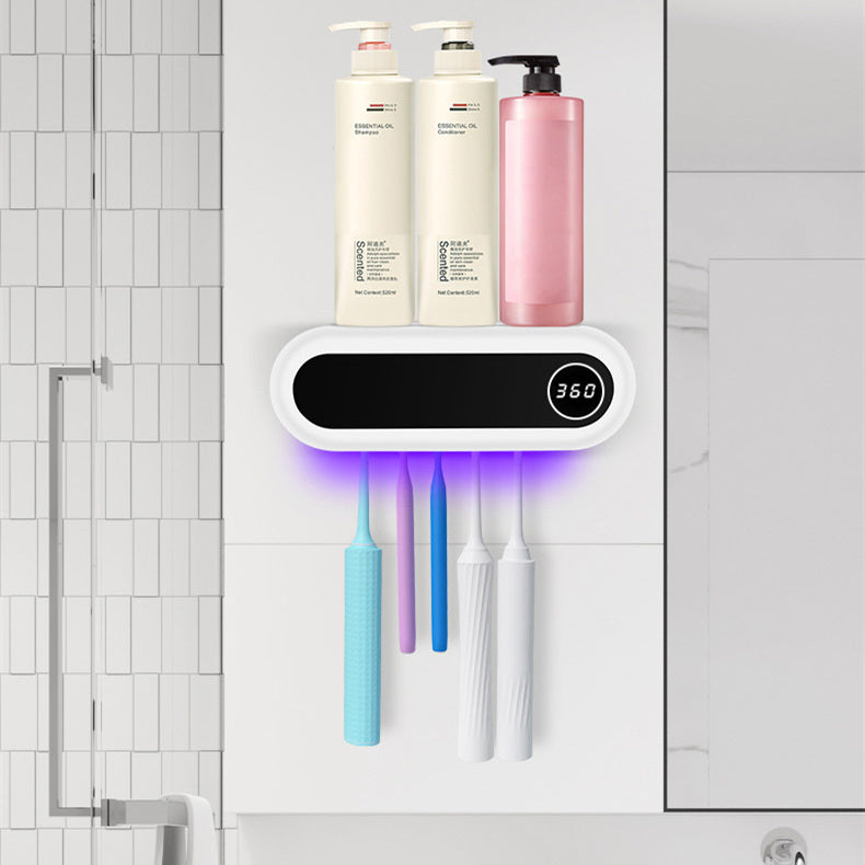 Jingqian wall-mounted toothbrush holder with UV sterilizer, toothpaste dispenser, and squeezer for bathroom accessories.