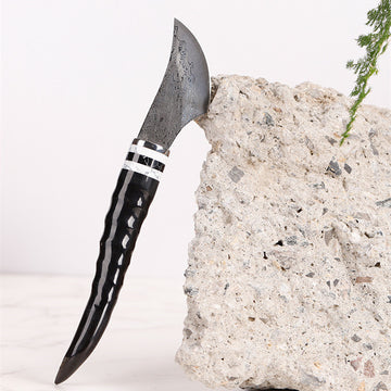 Portable Damascus steel sheep horn incense knife for incense supplies, traditional kitchen tool with detailed craftsmanship.