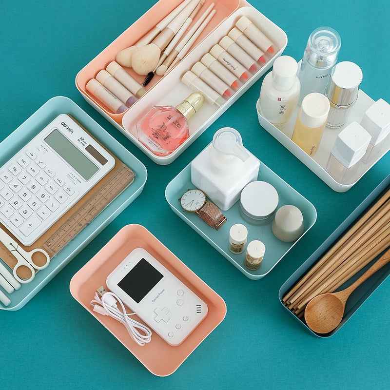 Multi-compartment drawer organizer for cosmetics and small household items.