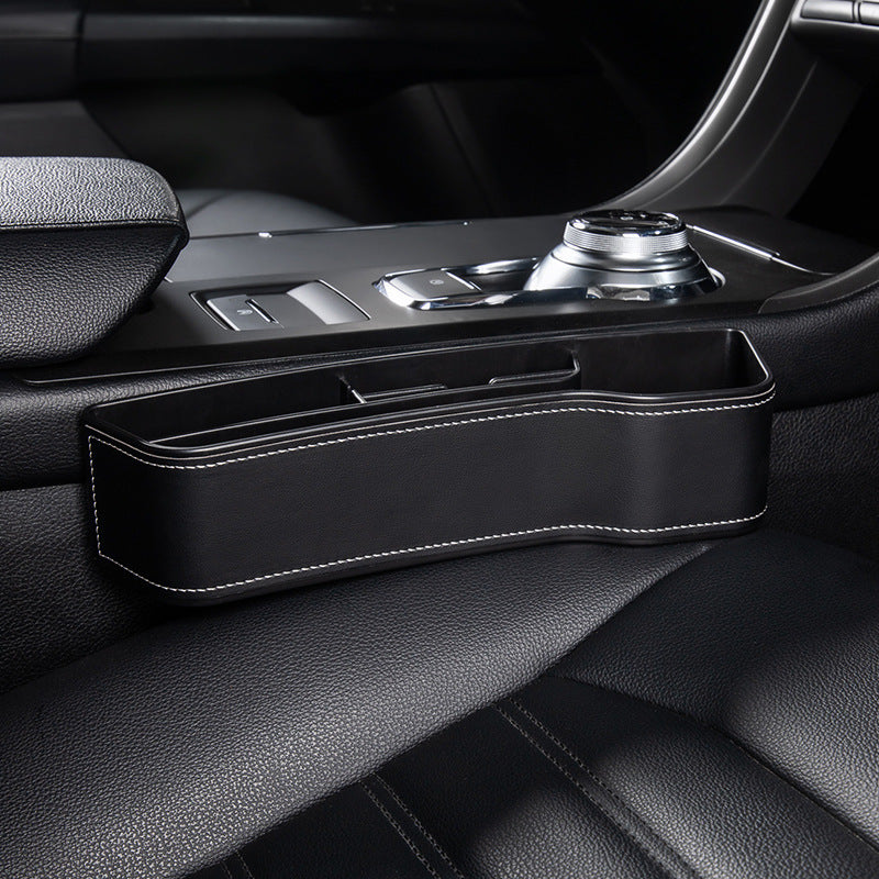 Aiqi car seat gap storage box fitting between car seats for organizing small items and preventing drops.
