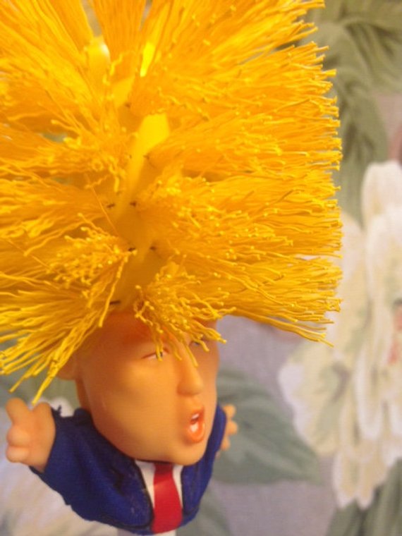 Funny Donald Trump toilet brush from RenFan, bathroom cleaning tool with humorous design, featuring a Donald Trump figure shape.