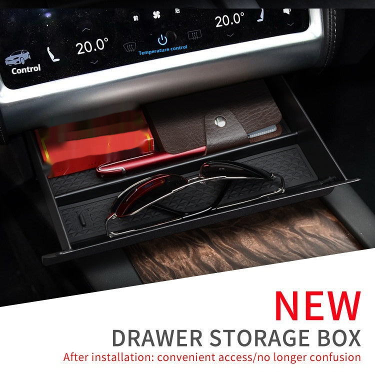 Jingqian car central storage grid drawer box with multiple compartments for organized vehicle storage.