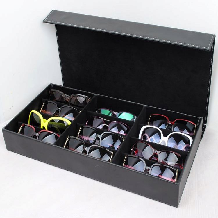 Black glasses storage box with grid compartments and PU leather exterior, perfect for organizing sunglasses and eyewear.