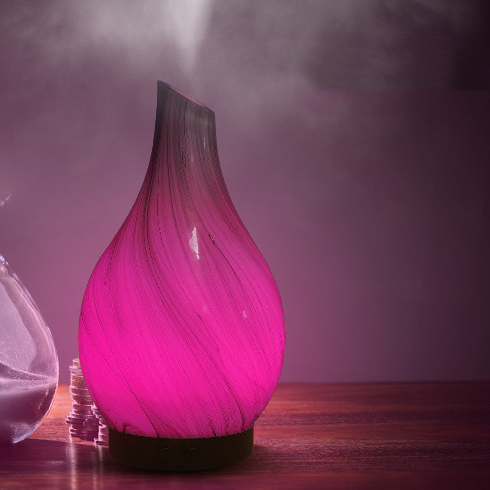 Colorful RenFan aromatherapy humidifier with a modern design, emitting mist for relaxing aromatherapy.