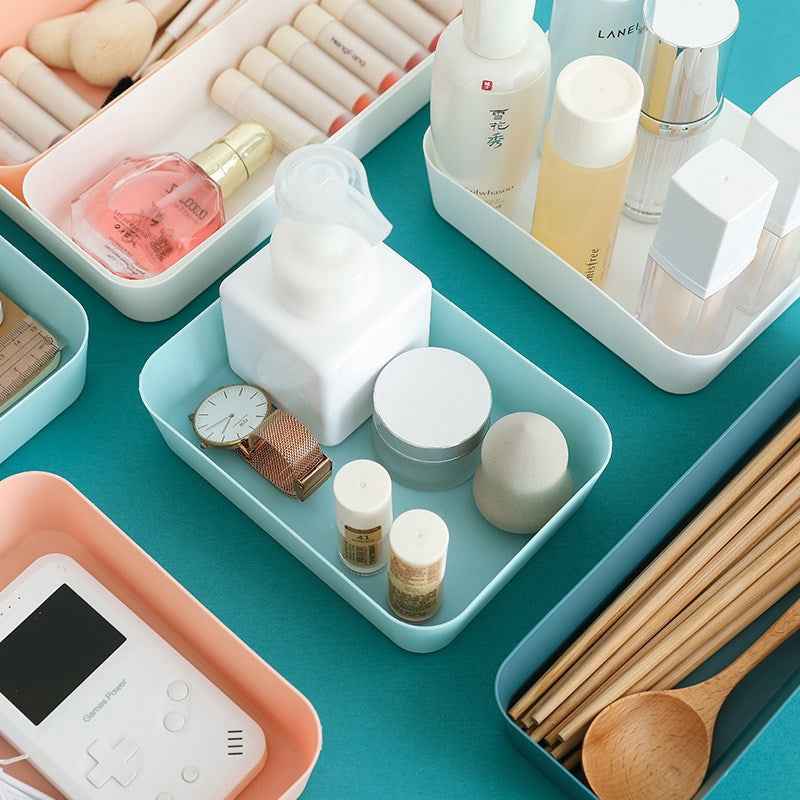 Drawer organizer with compartments for accessories, socks, and essentials.
