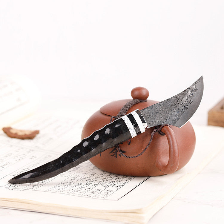 Portable Damascus steel sheep horn incense knife for incense supplies, with a traditional design and sharp blade.