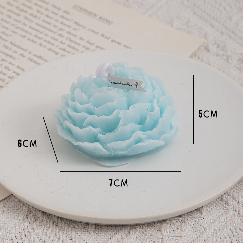 Handmade peony flower aromatherapy candle by Aiqi with a soft floral design in a glass container.