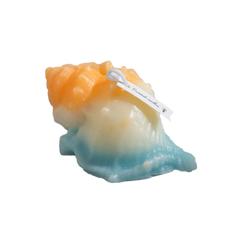 RenFan conch shell aromatherapy candle gift with a natural conch shell and lit wick, perfect for relaxing aromatherapy sessions.