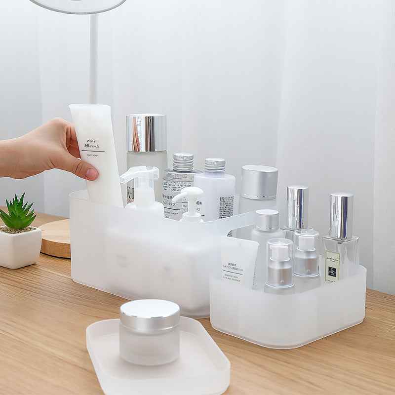 Desktop cosmetic storage box for makeup and skincare items.
