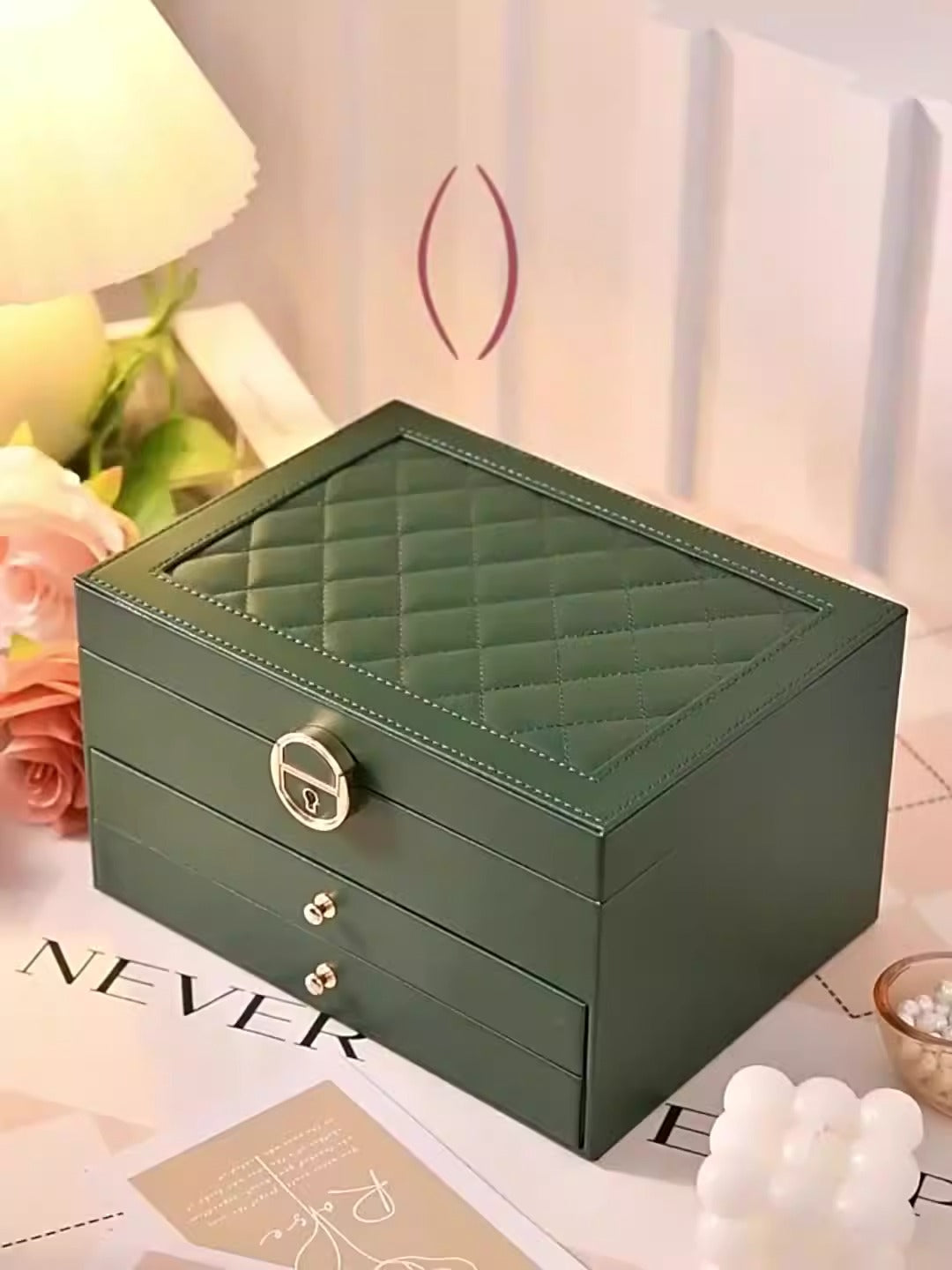 Large leather jewelry box by PETART with three-tier drawers, holding necklaces, earrings, and bracelets for home storage.