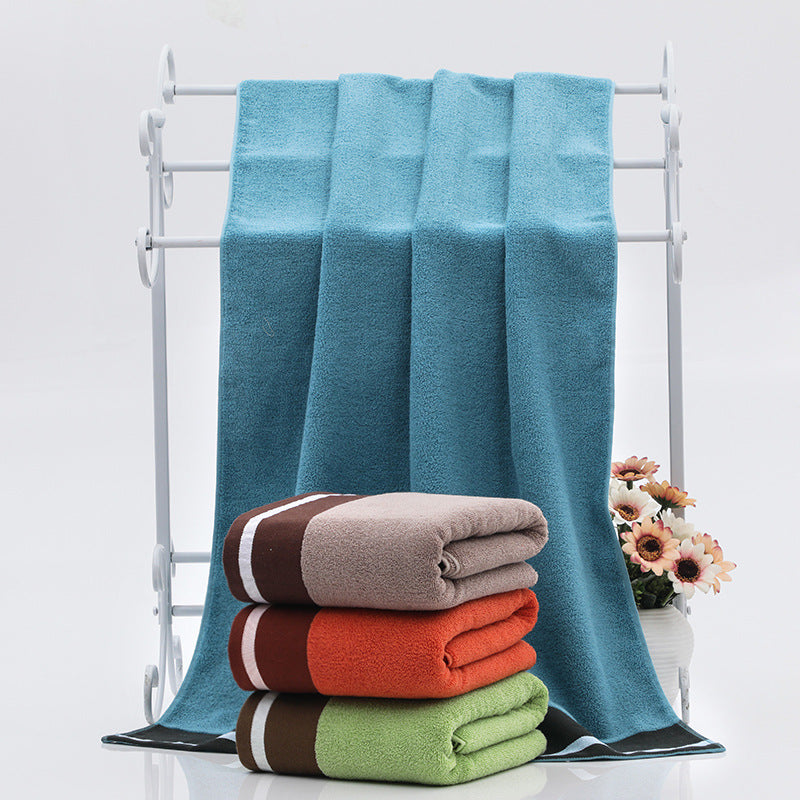 Soft white RenFan cotton bath towel with plush texture, ideal for bathroom use and quick drying.