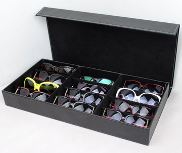 Black glasses storage box with grid compartments, made of PU leather, ideal for organizing sunglasses and eyewear.