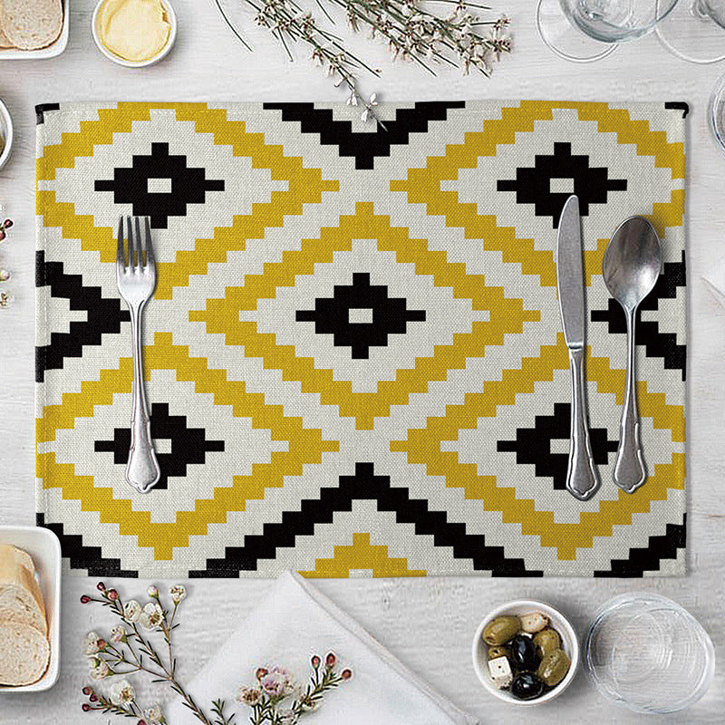 Aiqi geometric pattern dining table placemat with colorful, modern design on a kitchen countertop.