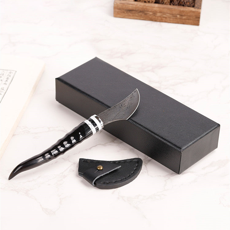 Portable Damascus steel sheep horn incense knife for incense supplies, featuring traditional design and craftsmanship.