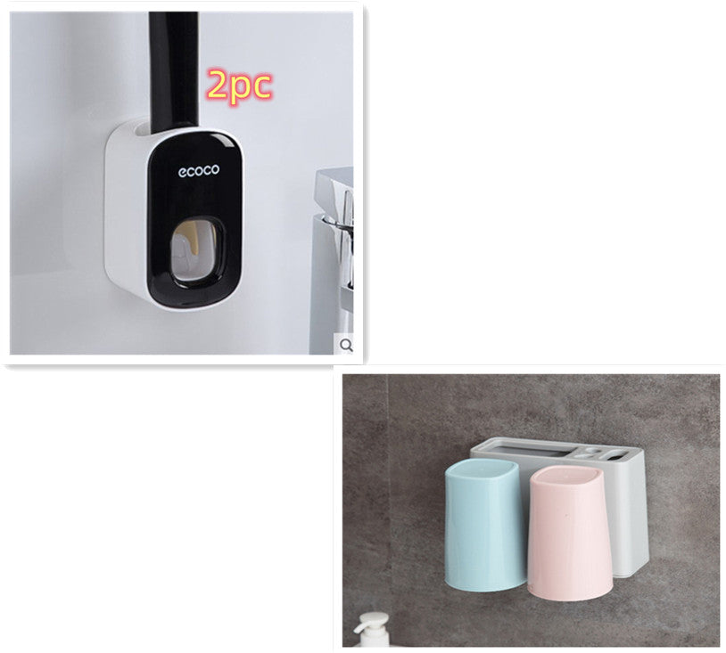 Wall-mounted automatic toothpaste holder from RenFan with bathroom accessories set and dispenser, mounted on bathroom wall.